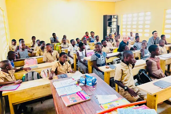 Rehabilitated classroom in Agboville with students