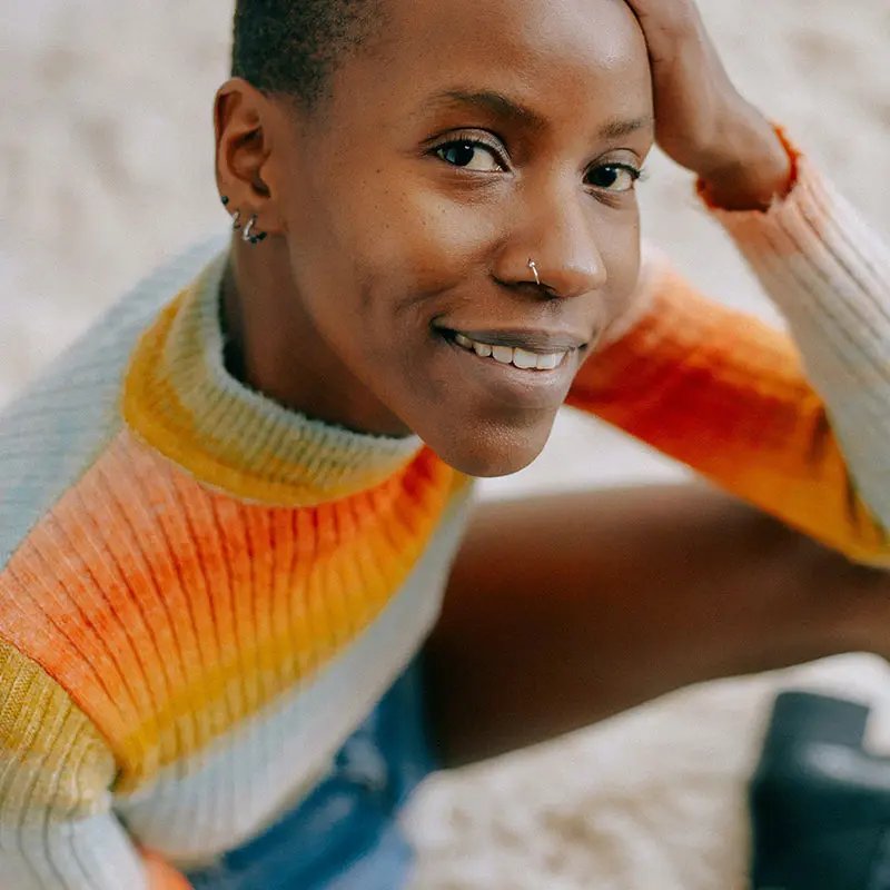 Woman in orange-white jumper