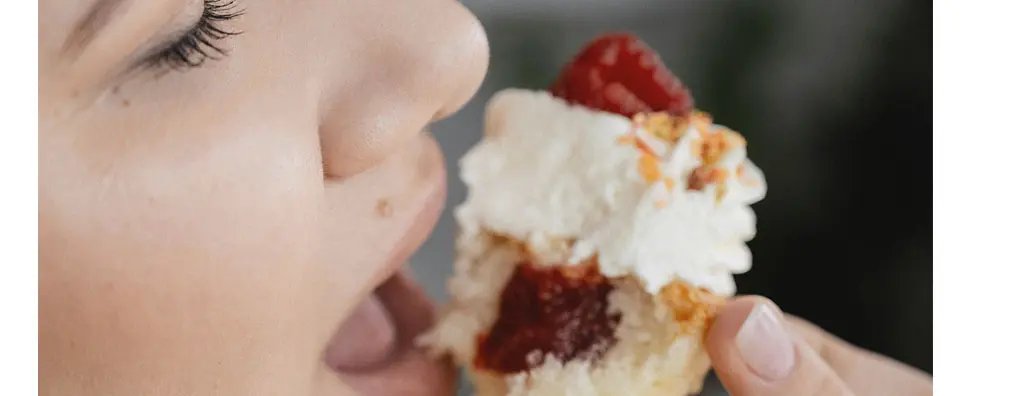 Woman eating a piece of cake