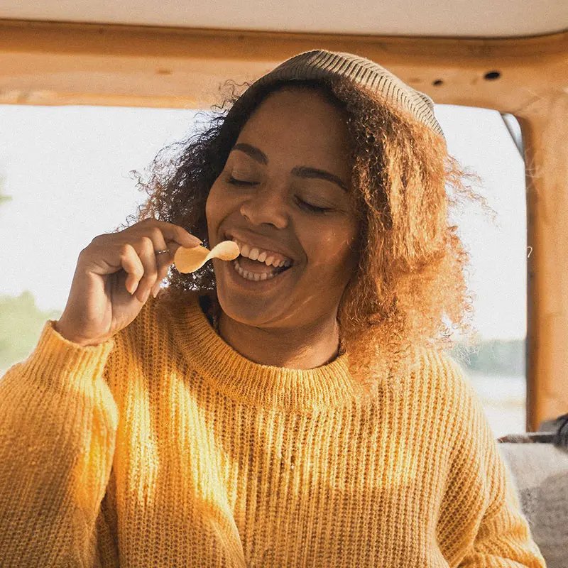 Girl eating crisps